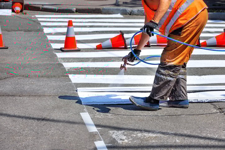 spray painting road markings pedestrian crossing